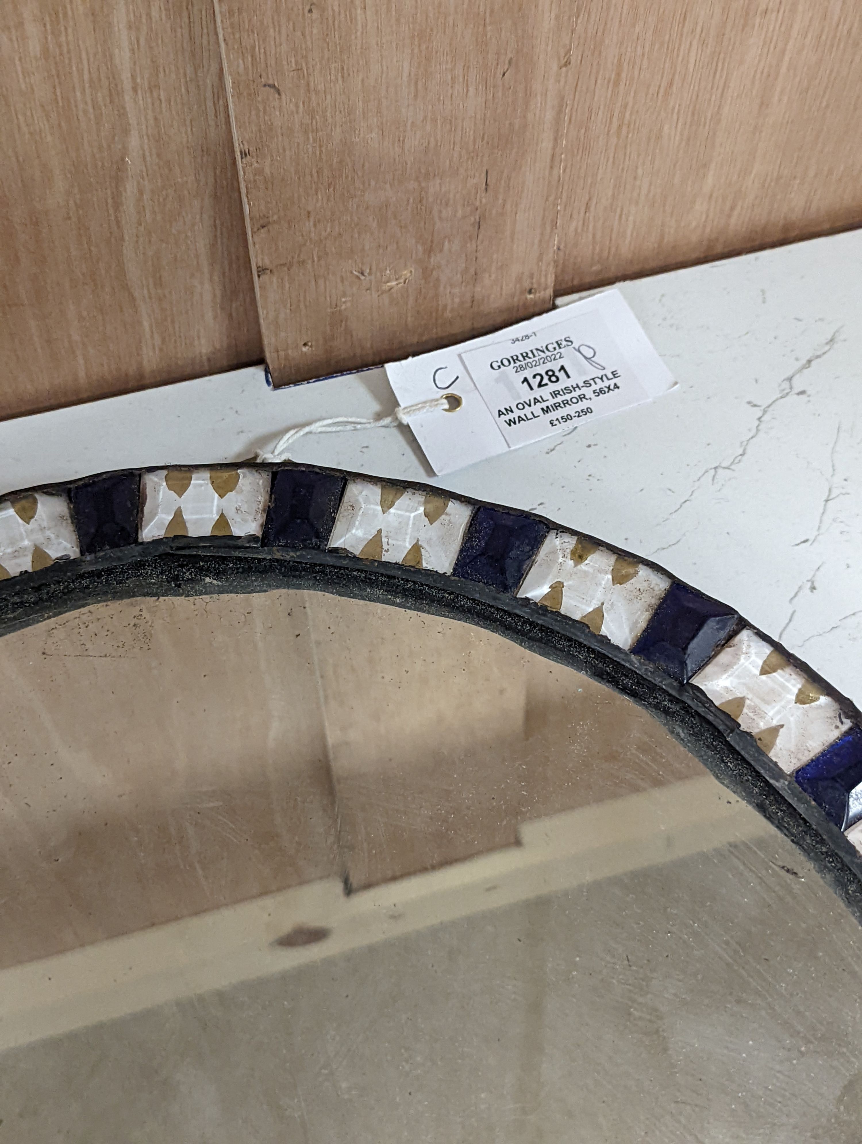 An oval Irish-style wall mirror, 56x41cm